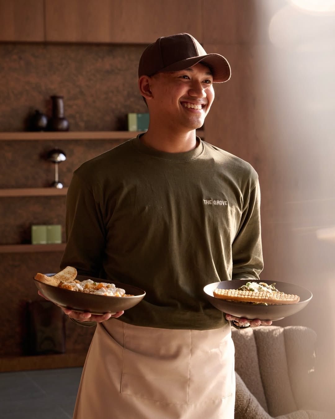 Chef Ren Ito preparing a dish in the kitchen
