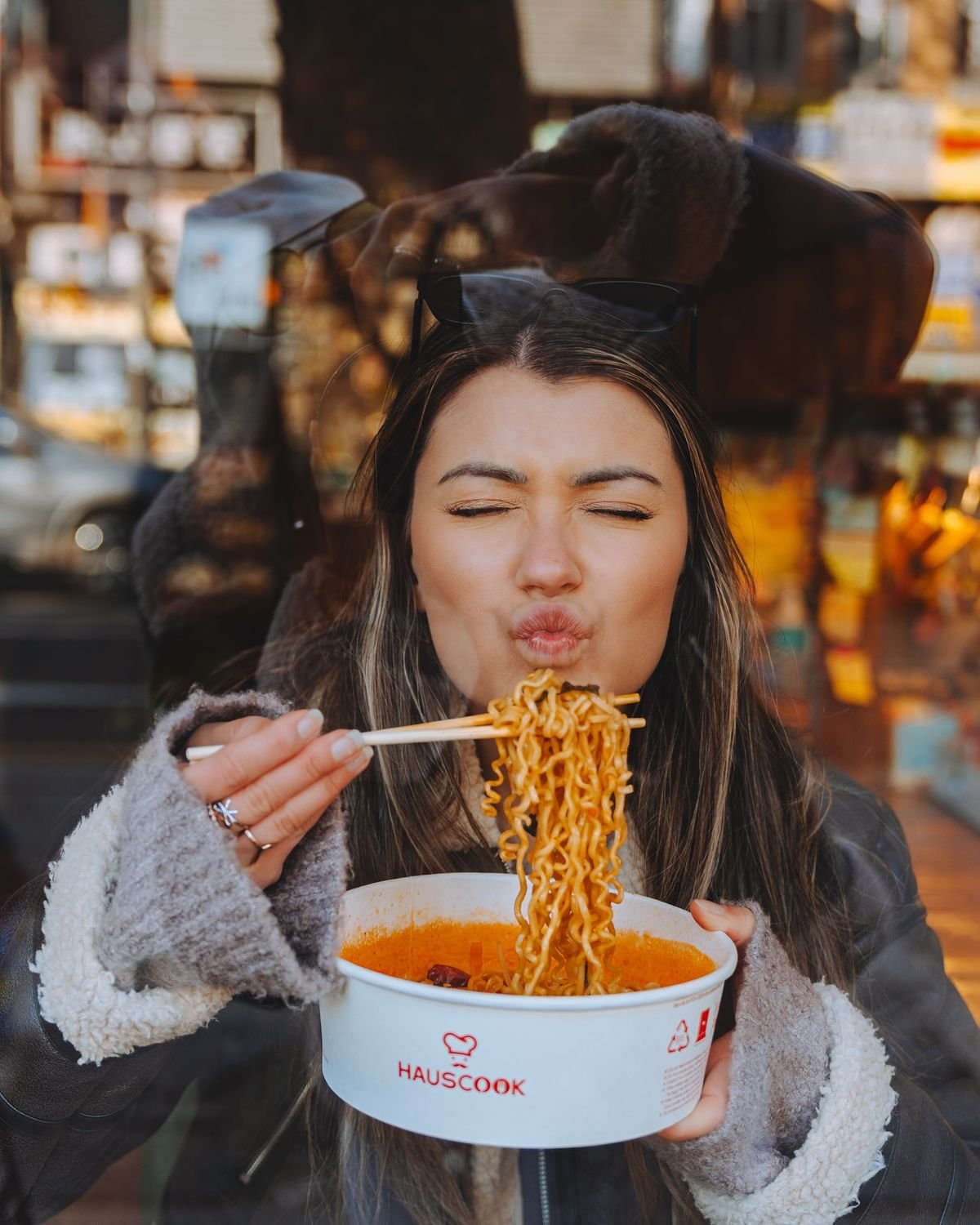 Noodles held up with chopsticks
